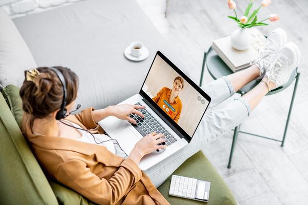 Woman on a virtual interview sitting on her couch