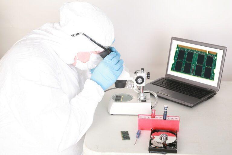 man looking in a microscope