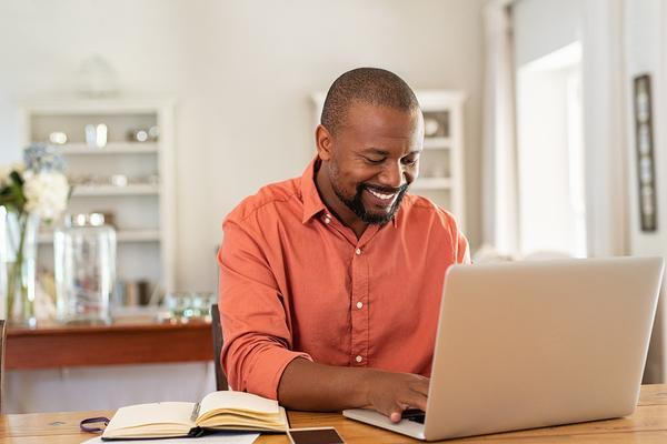 Man working from his home on his laptop