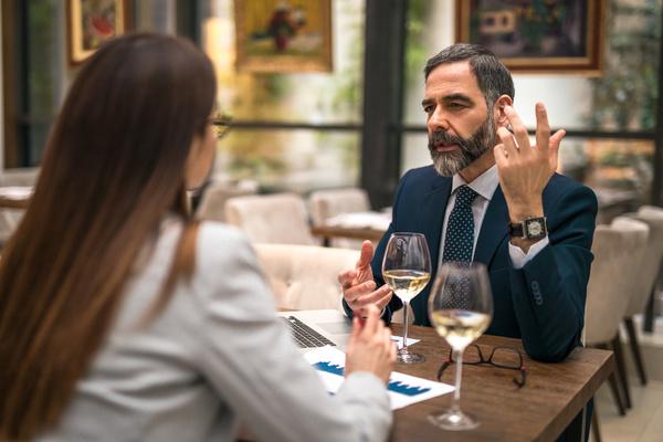 Two colleagues having a business lunch