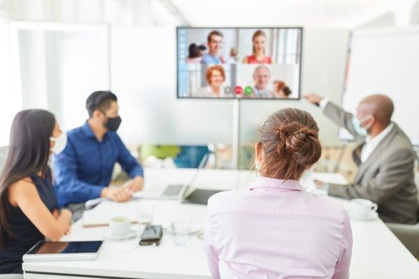 meeting with virtual participents on the big screen