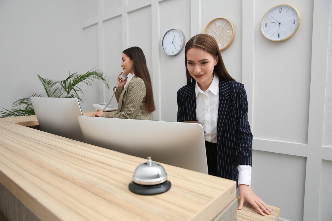 two girls behind a reception desk