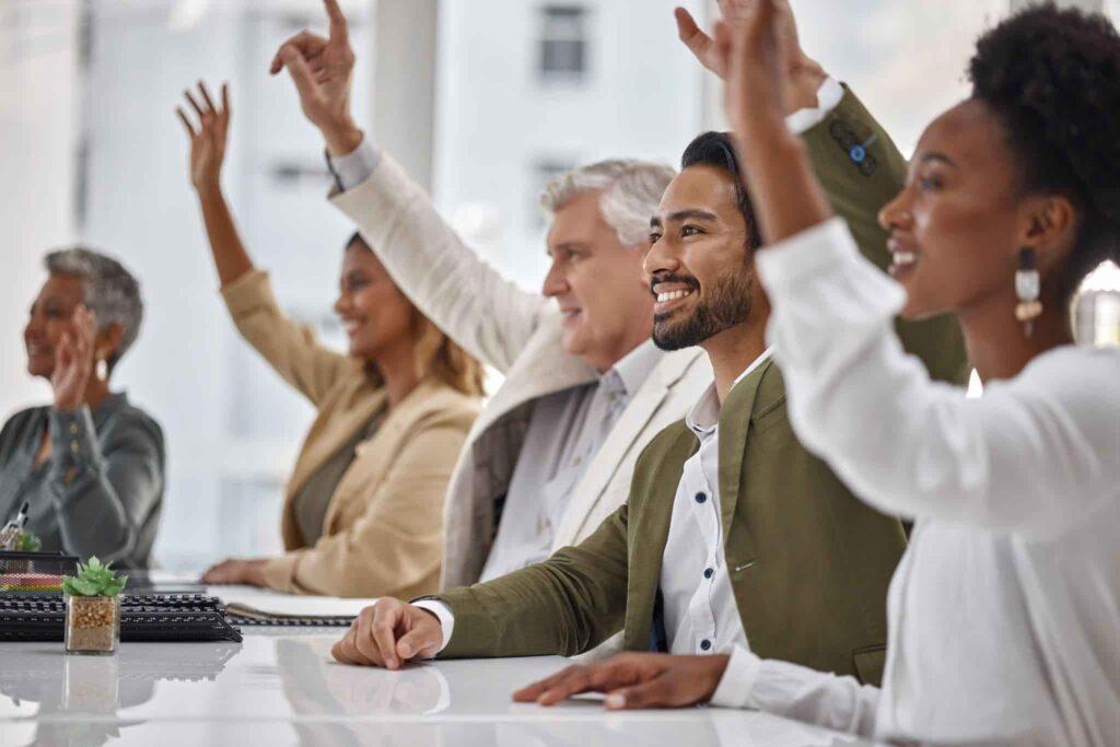 raising hands in a meeting