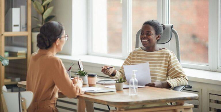 two woman in an interview