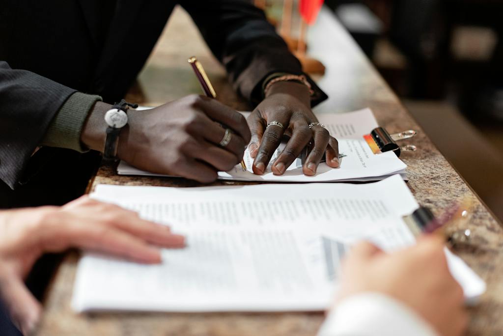 Person Writing on White Paper